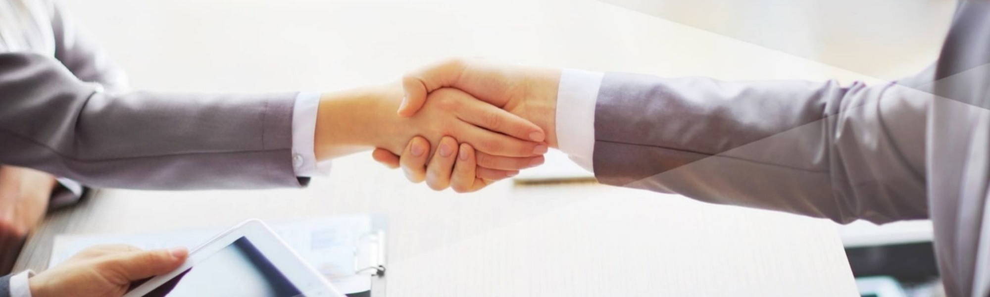 two people shaking hands business meeting interview